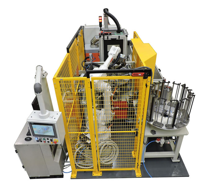 Robot en máquina de soldadura de piezas
